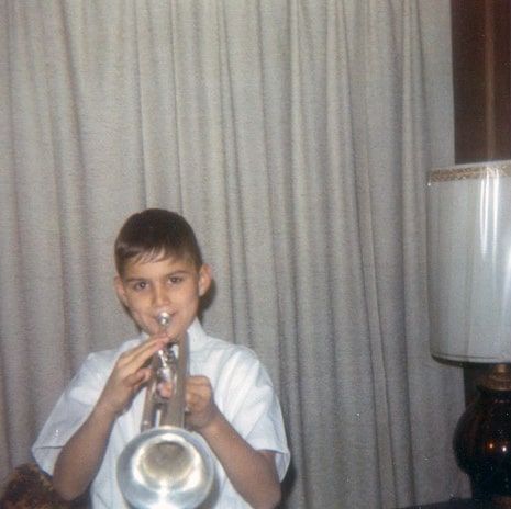 Kevin Wakefield as a young boy playing his first trumpet
